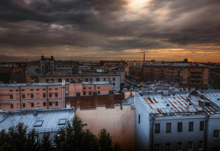 a view of a city from the top of a building, an album cover, by Alexey Venetsianov, pexels contest winner, renaissance, sun after a storm, flooding, brown, late afternoon light