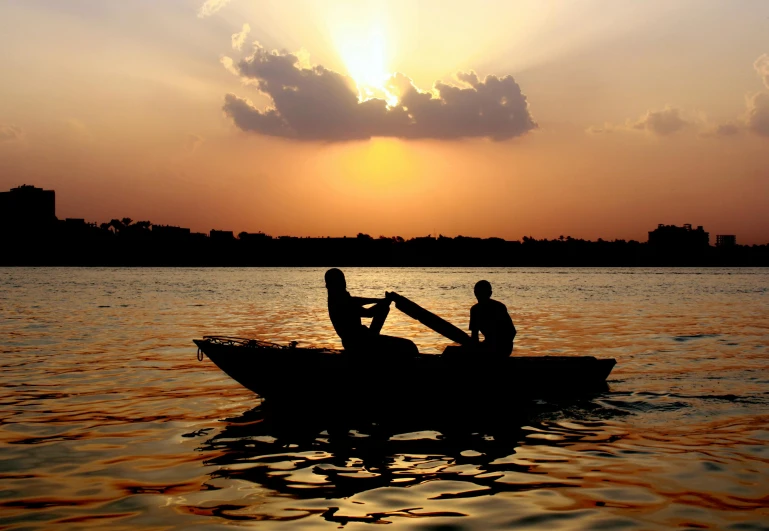 a couple of people on a small boat in the water, pexels contest winner, hurufiyya, thumbnail, evening sun, nile river environment, slide show