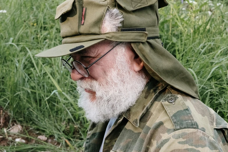 a close up of a person wearing a hat, inspired by Wojciech Weiss, reddit, camouflage uniform, greybeard, outdoor photo, avatar for website