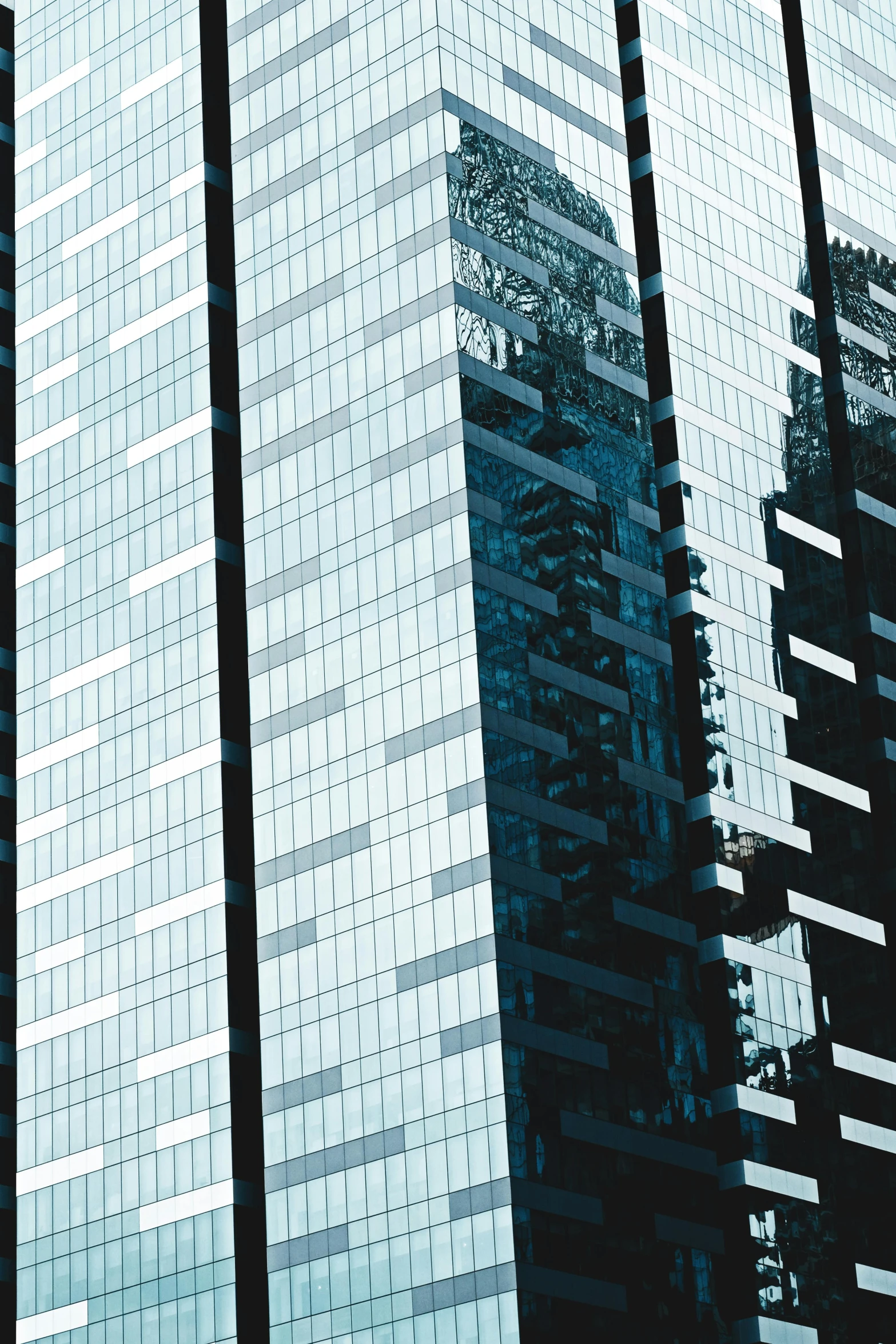 a group of tall buildings sitting next to each other, an album cover, inspired by Andreas Gursky, pexels contest winner, modernism, blue reflections, glass texture, hyperdetailed, in hong kong