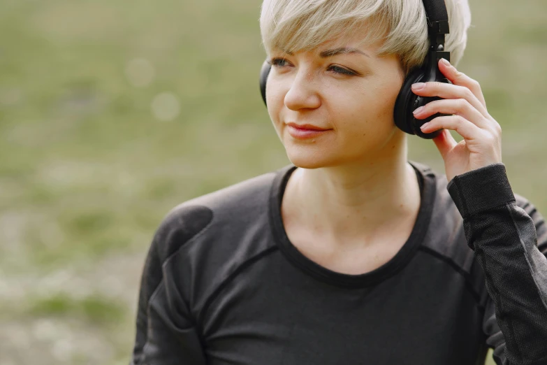 a woman talking on a cell phone while wearing headphones, trending on pexels, girl with short white hair, working out in the field, realistic »