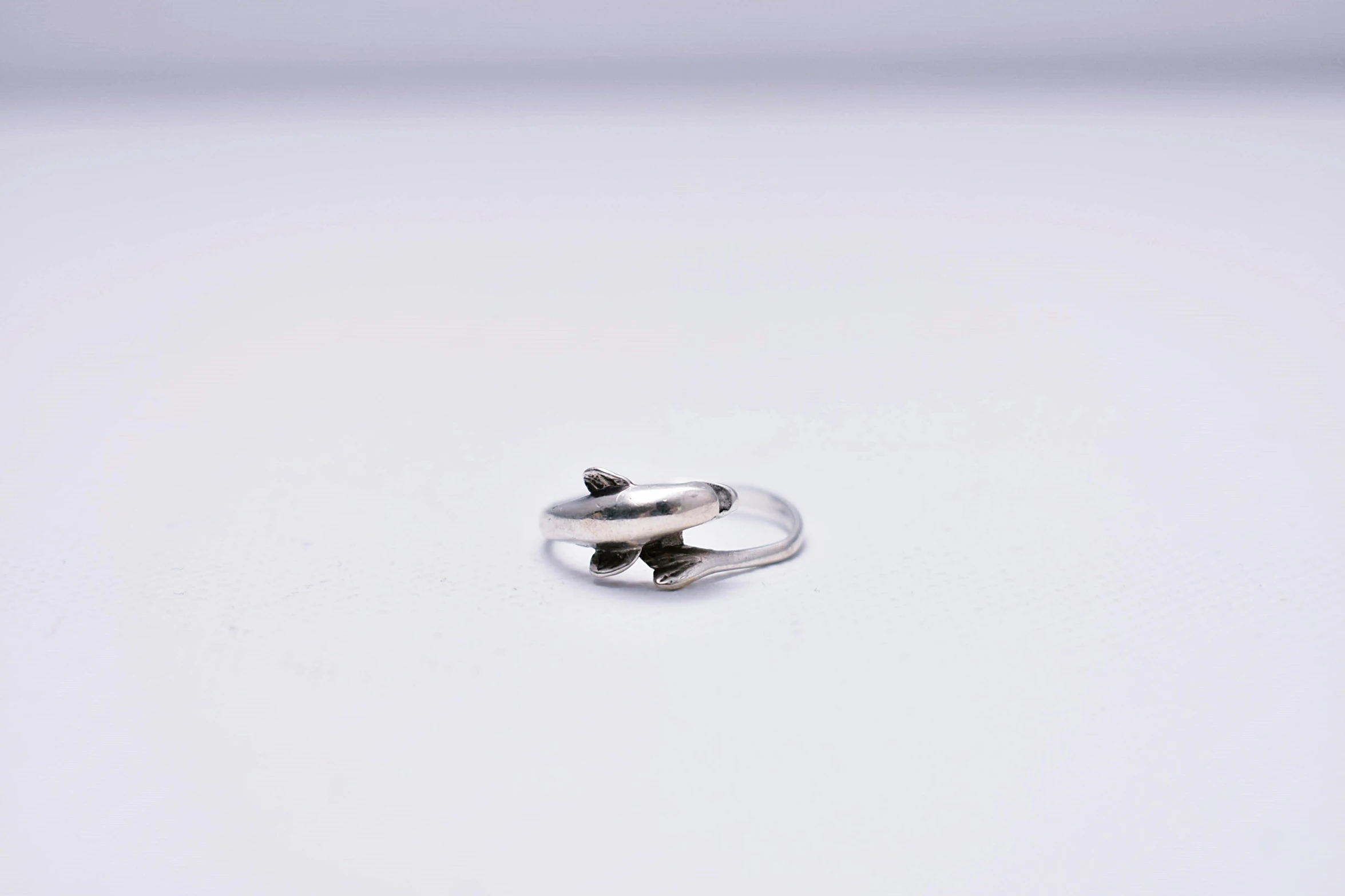 an ox ox ox ox ox ox ox ox ox ox ox ox ox ox ox ox ox, a tattoo, by Shigeru Aoki, unsplash, hurufiyya, hook as ring, on grey background, nudibranch, miniature product photo