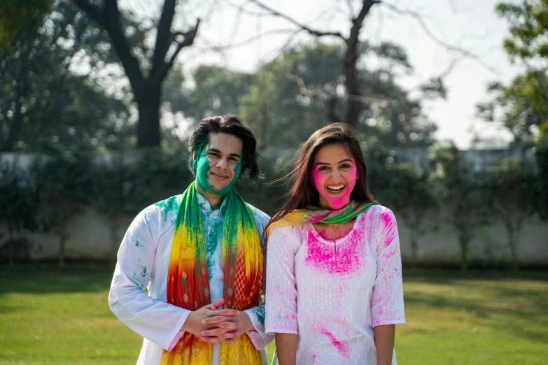 a couple of people that are standing in the grass, pexels, color field, wearing traditional garb, splatter, a still of a happy, test