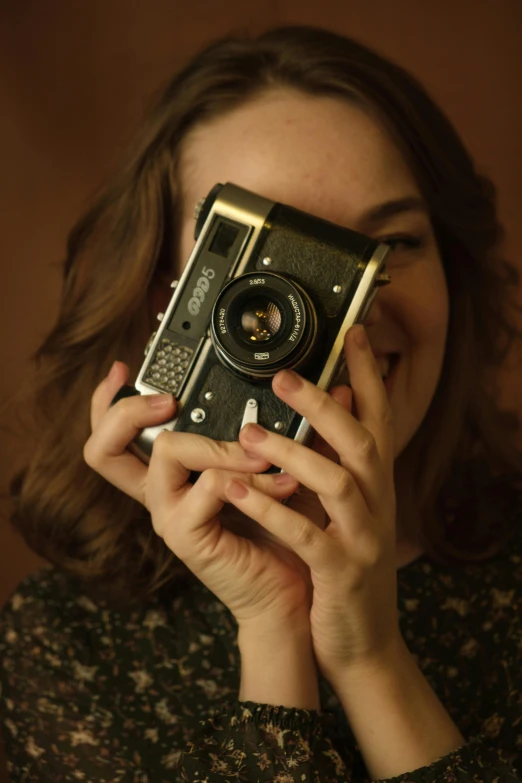 a woman taking a picture with a camera, smirking at the camera, camera obscura, vintage inspired, delightful