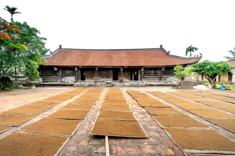 a building with a lot of dirt on the ground, inspired by Cui Bai, happening, historic, turf roof, detiled, wooden platforms