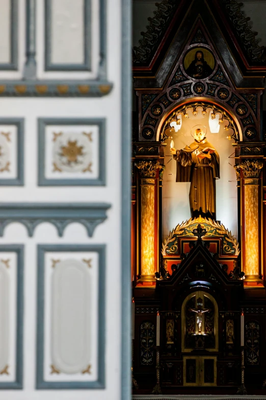 a picture of a statue inside of a building, a statue, inspired by Thomas Aquinas Daly, baroque, wood and gold details, massive decorated doors, 2 5 6 x 2 5 6 pixels, on the altar