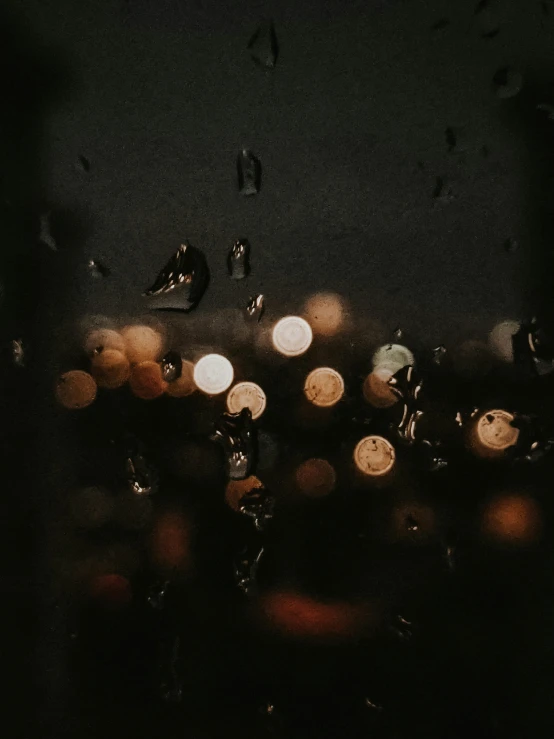 a view of a city through a window at night, a picture, unsplash contest winner, magical realism, tear drops, it\'s raining, beige and dark atmosphere, ☁🌪🌙👩🏾