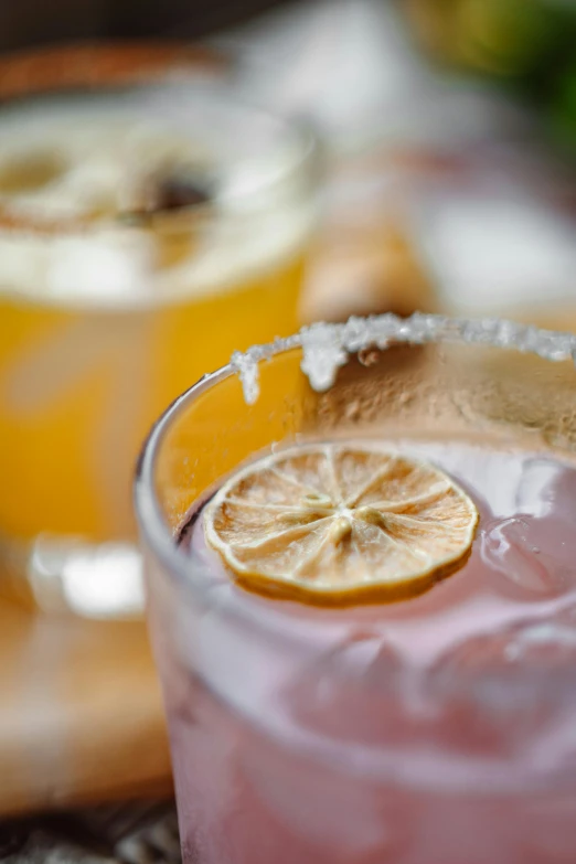 a close up of a drink in a glass on a table, albuquerque, zoomed in, lemonade, half moon