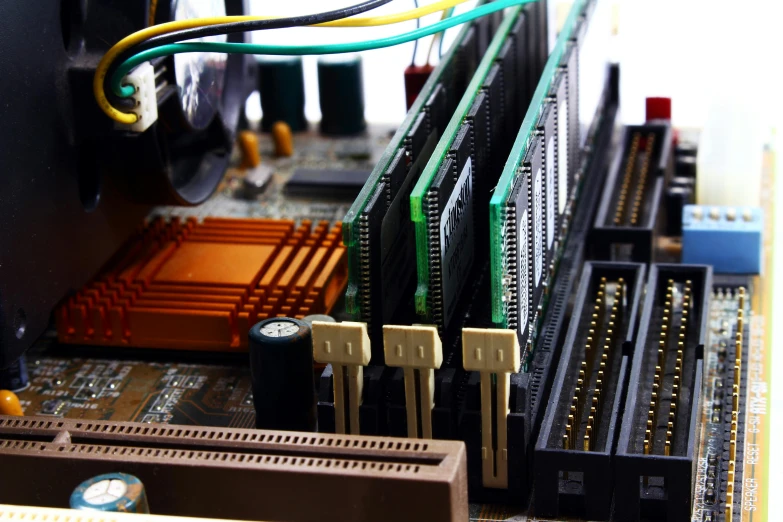 a close up of a computer mother board, a computer rendering, unsplash, 90s photo, a wooden, graphics card, stacked computer screens