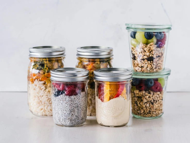 a group of jars filled with different types of food, by Nina Hamnett, pexels, big oatmeal, terrazzo, 6 pack, grey