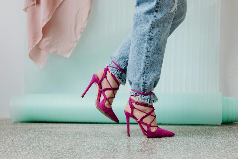 a close up of a person wearing high heels, trending on pexels, magenta, cords, tight blue jeans and cool shoes, torn cosmo magazine style