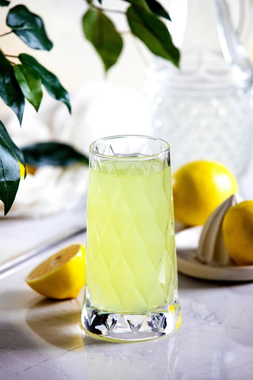 a glass of lemonade sitting on top of a counter, diamond, cheeks, promo image, at home