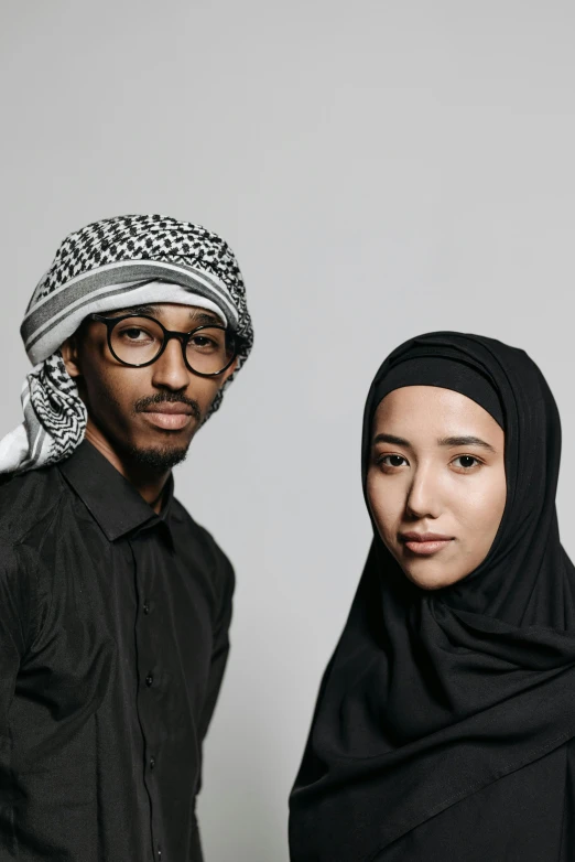 a man and a woman standing next to each other, hurufiyya, promo photo, courtesy of moma, gen z, gulf