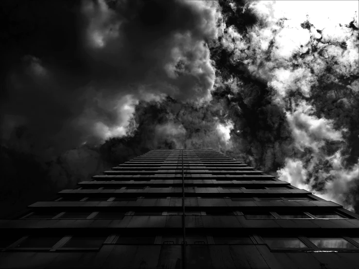 a black and white photo of a tall building, by Adam Pijnacker, unsplash, toxic clouds, hell scape, daily deviation on deviantart, black and white artistic photo