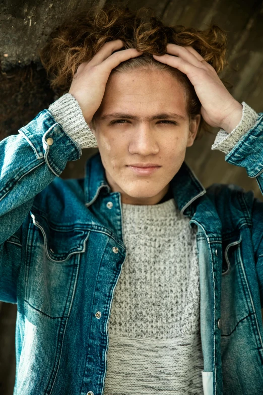 a close up of a person wearing a denim jacket, by Jan Tengnagel, light brown messy hair, male teenager, promo image, head to waist