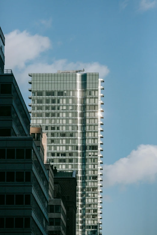 a couple of tall buildings sitting next to each other, inspired by Richard Wilson, unsplash contest winner, modernism, ignant, exterior view, telephoto long distance shot, panels