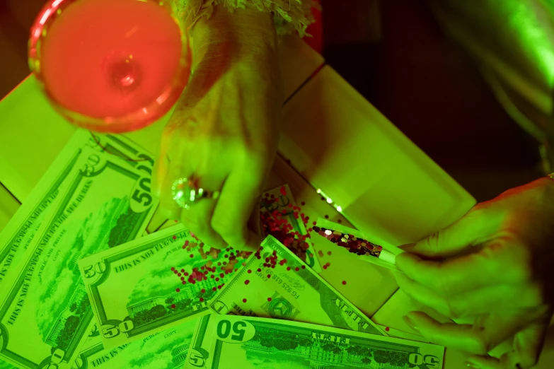 a bunch of money sitting on top of a table, inspired by Elsa Bleda, dayglo, holiday season, woman, bedazzled