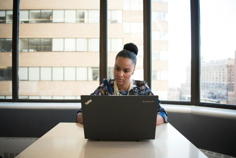 a woman sitting in front of a laptop computer, by Jessie Algie, pexels contest winner, tech demo, aida muluneh, official screenshot, 15081959 21121991 01012000 4k