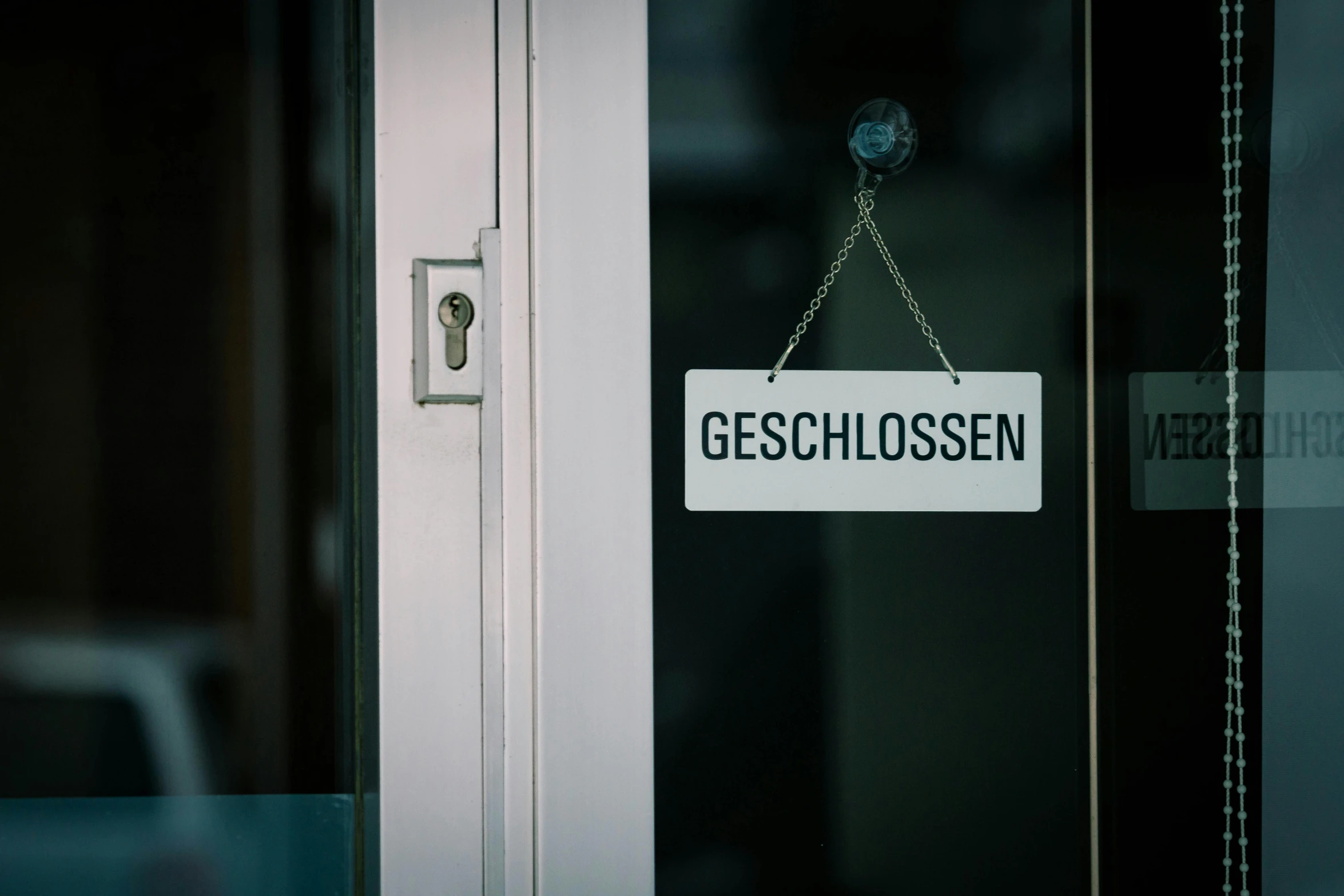 a close up of a sign on a door, by Georg Schrimpf, unsplash, local conspirologist, half - occupied with people, high quality photo, obsession