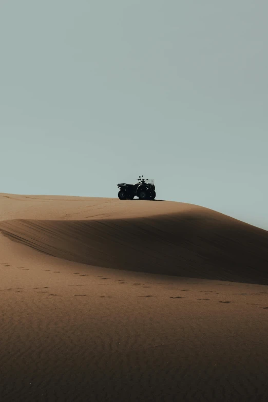 a vehicle that is sitting in the sand, pexels contest winner, the wise man is riding on top, minimalist, technical, tan