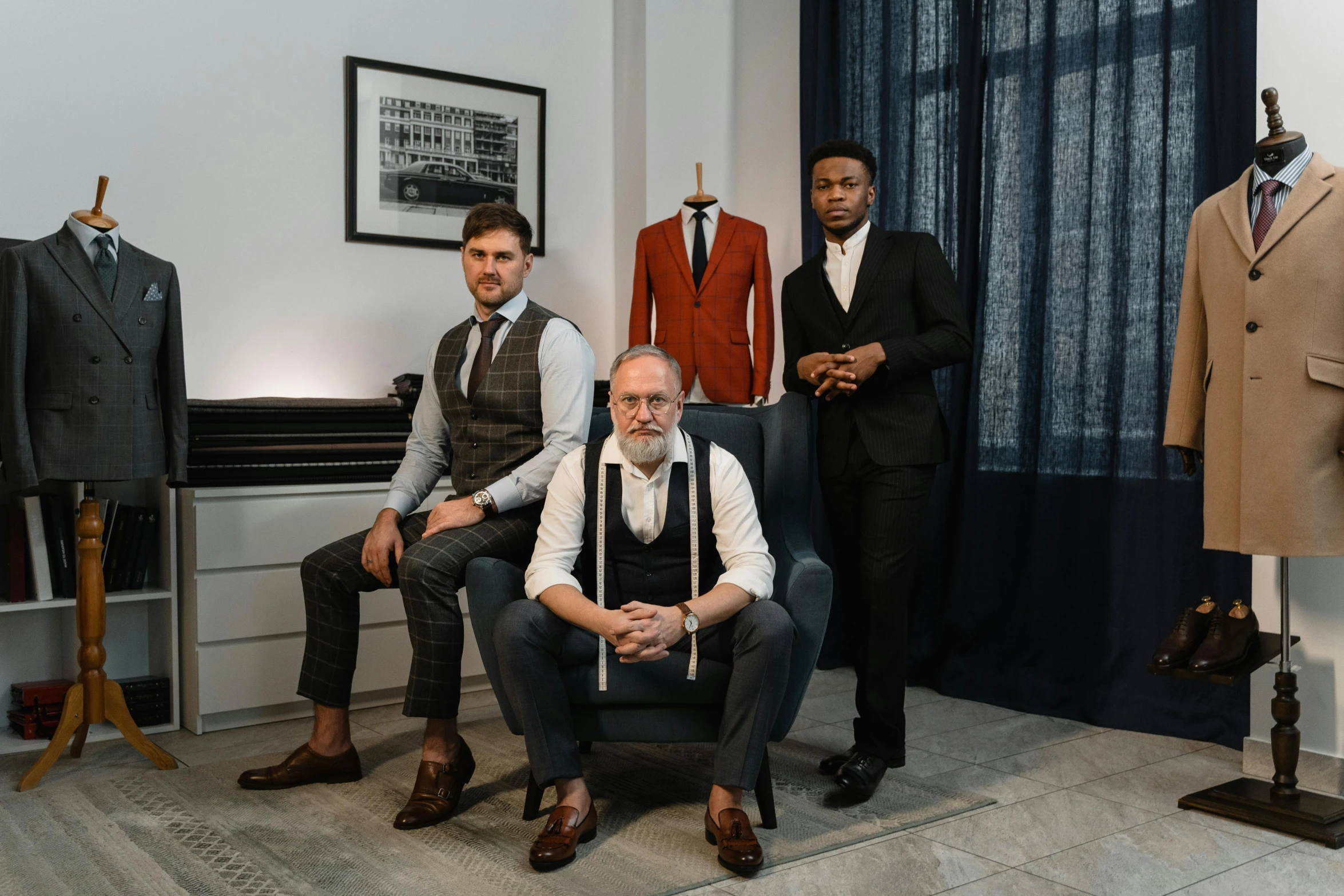 a group of men sitting next to each other in a room, a portrait, by Emma Andijewska, pexels contest winner, tailored clothing, three piece suit, artisan, advert