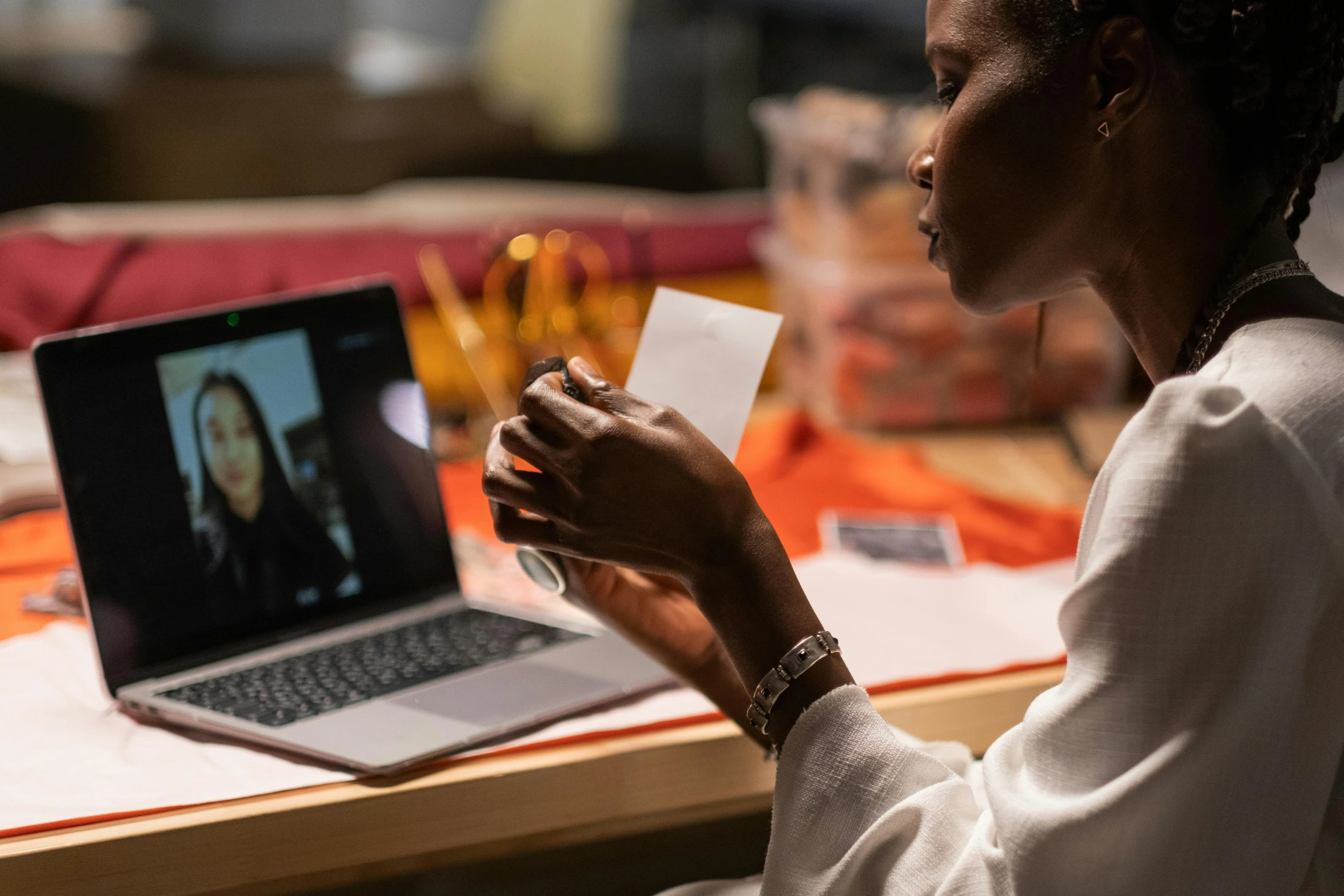 a woman sitting at a table in front of a laptop, pexels contest winner, video art, olivia pope, steve mccurry and irakli nadar, performing, profile image