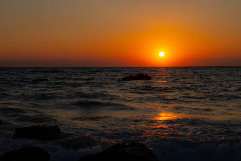 the sun is setting over a body of water, pexels contest winner, romanticism, cyprus, burning ocean, high quality photo, album