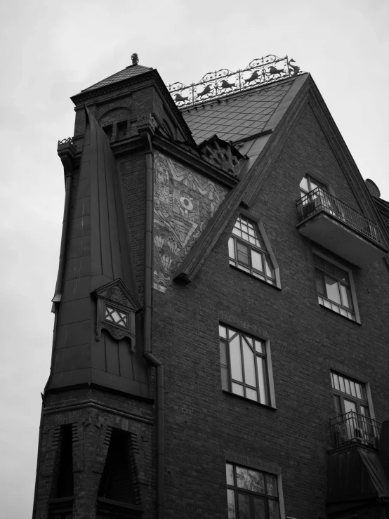 a black and white photo of a tall building, unsplash, art nouveau, swedish house, tired and haunted expression, 8k 50mm iso 10, brick building