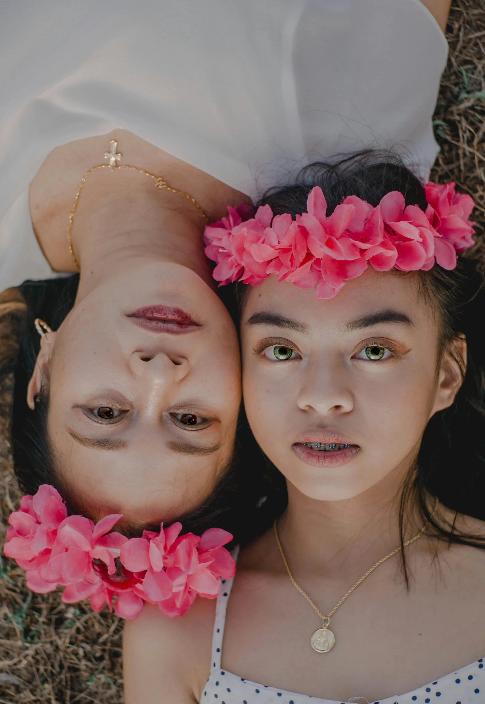 a couple of girls laying on top of each other, an album cover, pexels contest winner, wearing a flower headpiece, modeling for dulce and gabanna, portrait close - up, instagram post