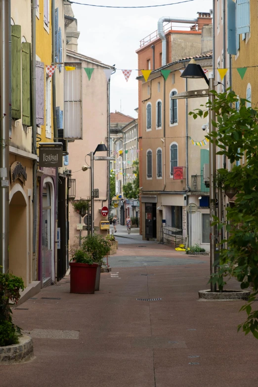 a city street filled with lots of tall buildings, inspired by François Barraud, renaissance, lourmarin, seaside, well decorated, cloisonne