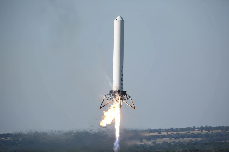 a rocket launching into the air with smoke coming out of it, spacehip lands, in 2 0 1 5, flawless structure, wingspan