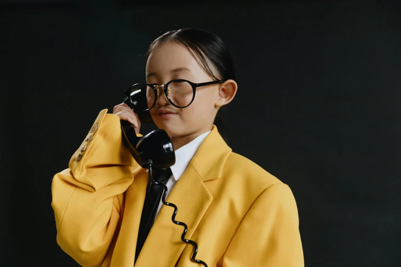 a young girl in a yellow suit talking on a phone, trending on pexels, hyperrealism, dressed as schoolgirl, avatar image, wenfei ye, professional product photo