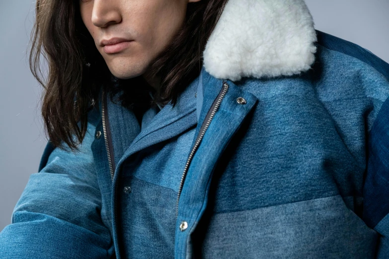 a man with long hair wearing a blue jacket, inspired by Raphaël Collin, hibernation capsule close-up, wearing denim, inuit, full product shot