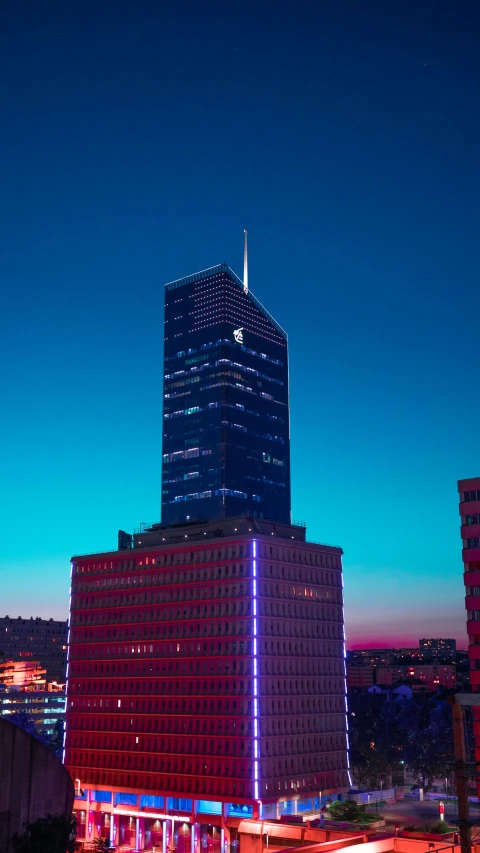 a view of a city at night from the top of a building, an album cover, inspired by Mike "Beeple" Winkelmann, unsplash contest winner, modernism, warsaw, james turrell building, blue sky, office building