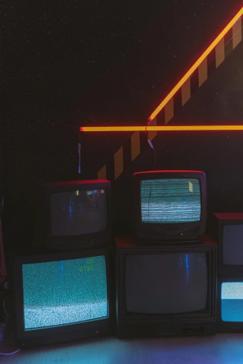 a group of televisions sitting on top of each other, an album cover, inspired by Elsa Bleda, unsplash, cyberpunk basement, photo from the 80s, radio signals, broken tv