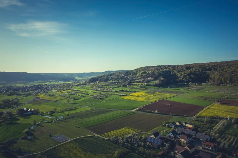 an aerial view of a small village in the mountains, pexels contest winner, les nabis, pur champagne damery, verdant field in the foreground, photo of zurich, minecraft landscape