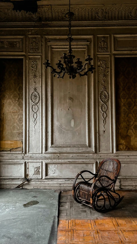 a rocking chair sitting in the middle of a room, an album cover, inspired by Marià Fortuny, unsplash contest winner, baroque, 1910s architecture, demur, ( ( photograph ) ), smooth panelling