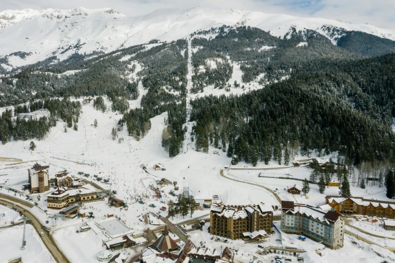 an aerial view of a ski resort in the mountains, pexels contest winner, art nouveau, sparsely populated, promo image, village in the background, big sky