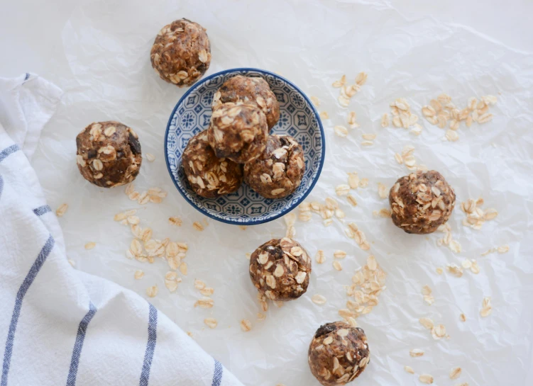 a bowl filled with oatmeal sitting on top of a table, energy spheres, 6 pack, petite, thumbnail