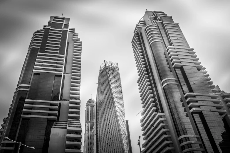 a black and white photo of skyscrapers in a city, by Erik Pevernagie, dubai, very sharp and detailed image, various posed, brutal archi