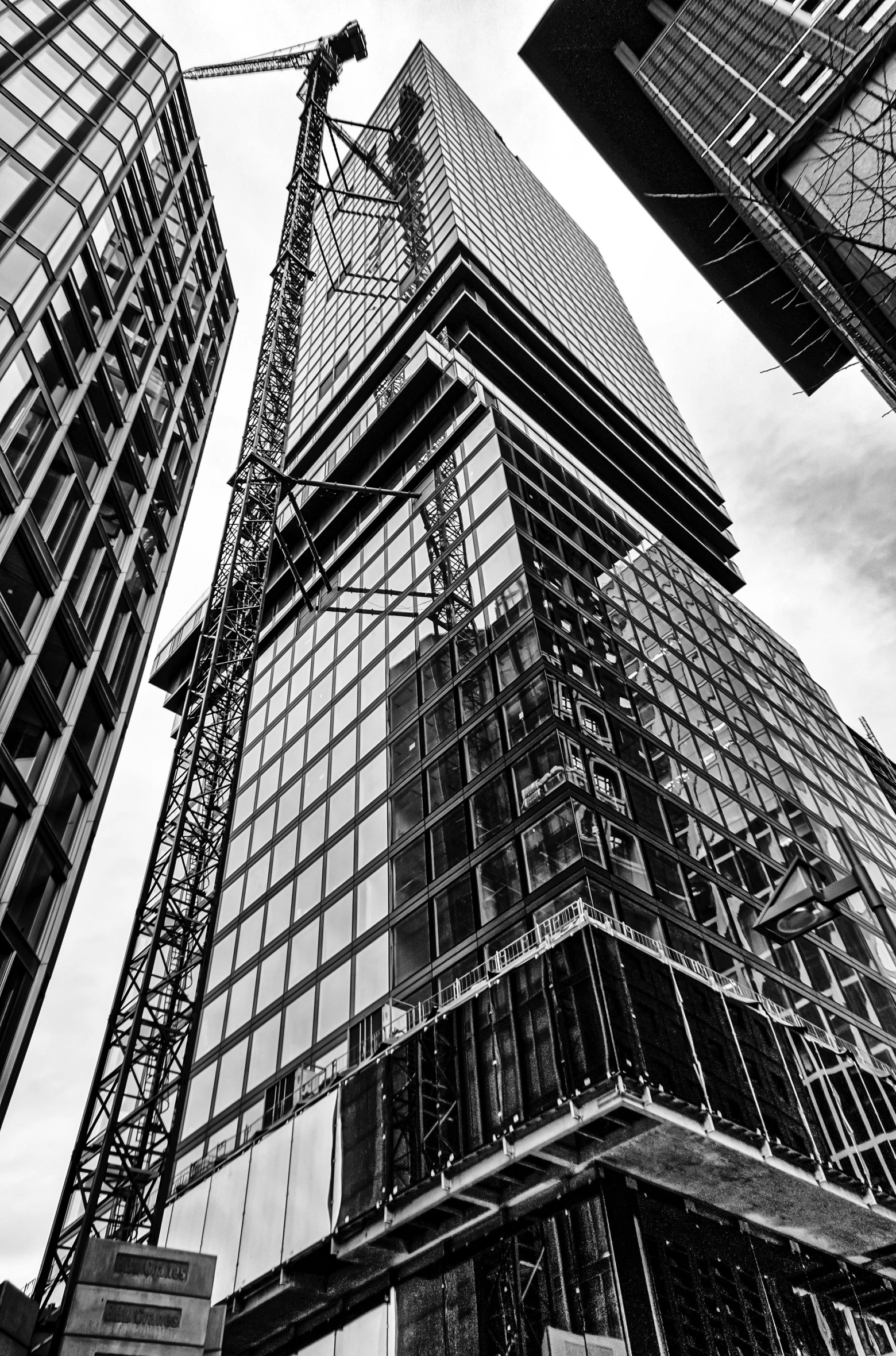 a black and white photo of a tall building, a picture, by Adam Rex, unsplash contest winner, constructivism, toronto city, under construction, !!highly detailed!!, buildings made out of glass