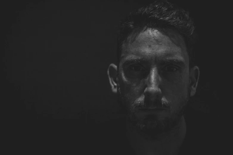 a black and white photo of a man's face, a black and white photo, by Giuseppe Avanzi, unsplash, conceptual art, trent reznor, shot at dark with studio lights, james jean andrei riabovitchev, hozier