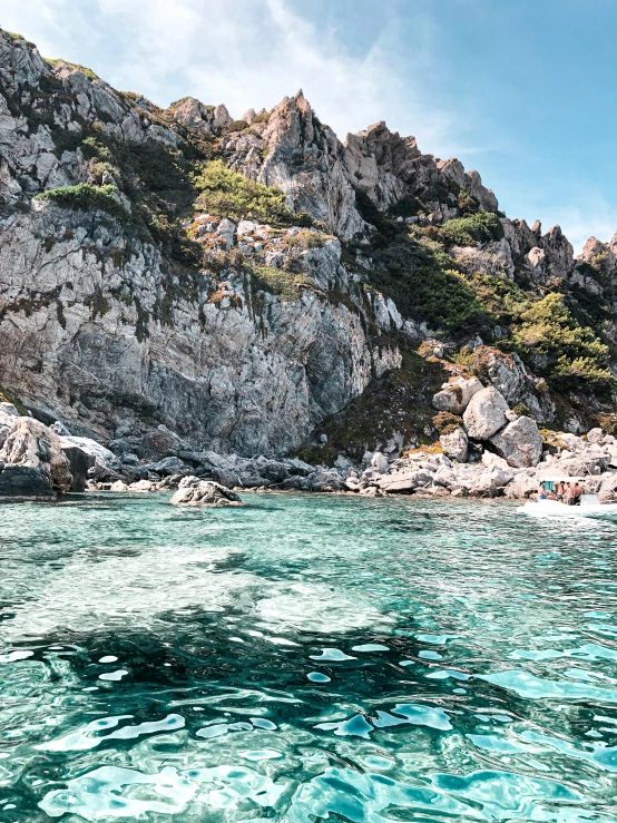 a body of water with a mountain in the background, capri coast, crystal clear neon water, slide show, full of details