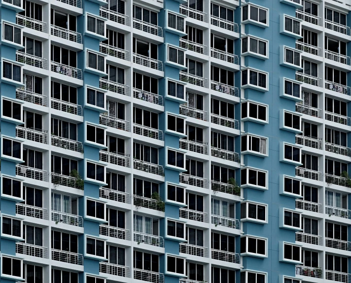 a very tall building with lots of windows, a portrait, inspired by Andreas Gursky, unsplash, hyperrealism, blue hues, apartments, singapore, slice of life”