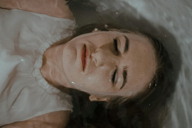 a woman laying in a bathtub with her eyes closed, trending on pexels, hyperrealism, ectoplasm, floathing underwater in a lake, a woman's face, corpse