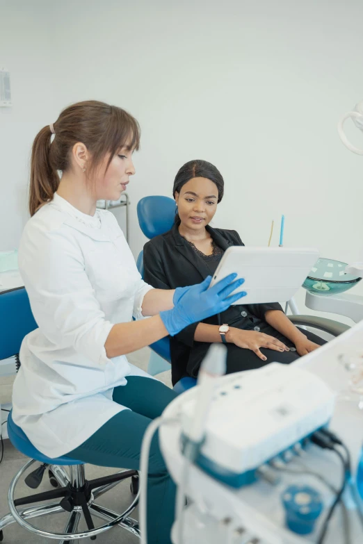 a woman sitting in a chair in a dentist's office, sterile colours, talking, with a whitish, profile image