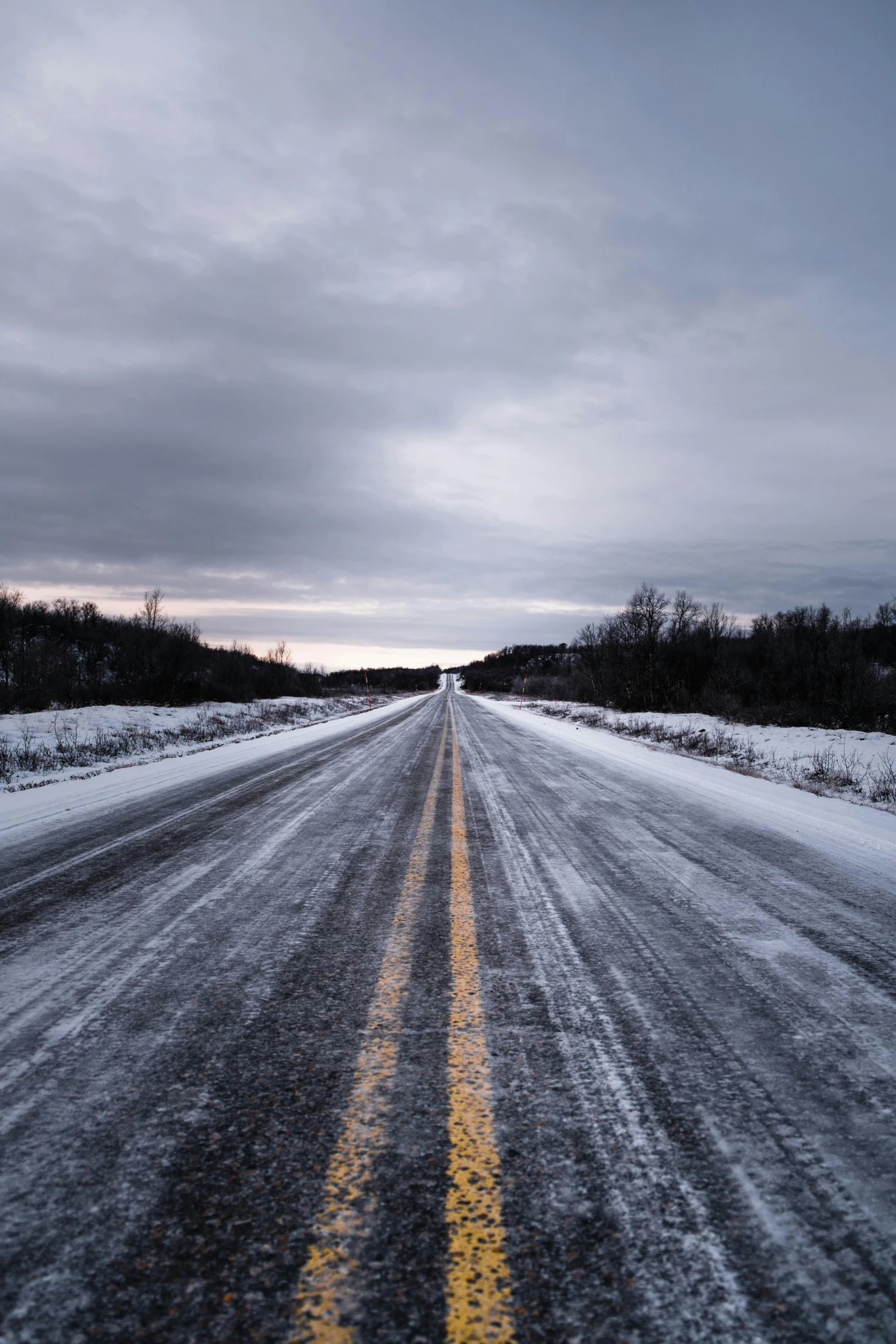 a snowy road with a yellow line in the middle, an album cover, unsplash, minn, highway to hell, technical, ice seracs