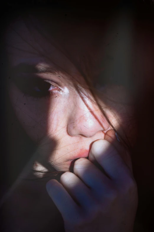 a close up of a person holding a cell phone, a picture, inspired by Elsa Bleda, romanticism, frightened look, woman crying, low-light, thoughtful )