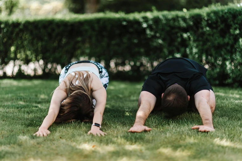 a man and a woman doing handstands in the grass, unsplash, private press, background image, lawns, profile image, lying on the ground