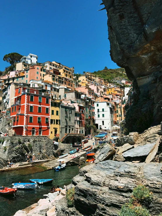 a group of boats floating on top of a river, by Patrick Pietropoli, pexels contest winner, renaissance, colorful ravine, cliffside town, panoramic, slide show